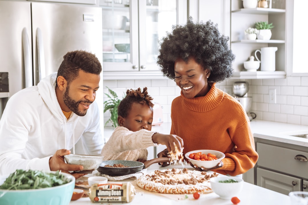 Family cooking together in a cozy RV kitchen